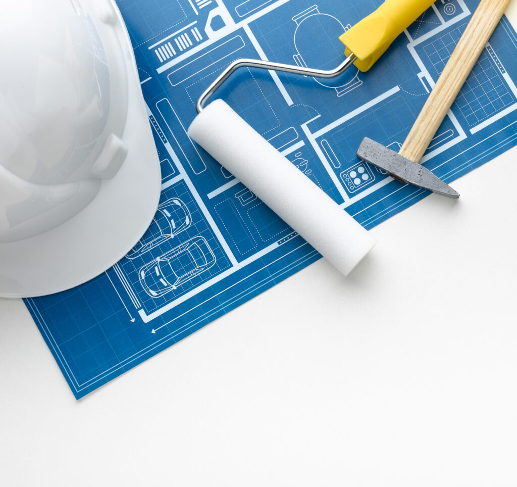 close-up-blue-print-construction-white-hat Construcción